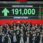 Traders at Pakistan Stock Exchange (PSX) celebrating as the market index hits a record-breaking 191,000 points.