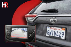 2024 Toyota Tundra Hybrid featuring the rear-view camera display and a safety recall notification.