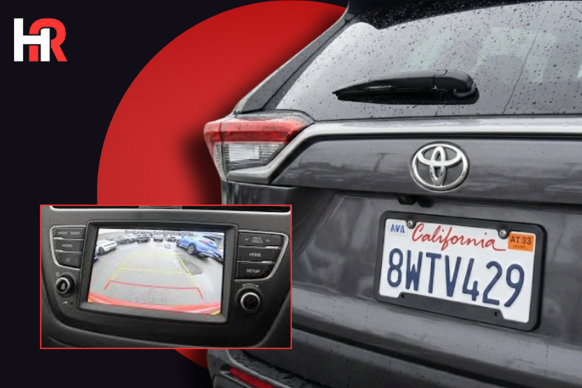 2024 Toyota Tundra Hybrid featuring the rear-view camera display and a safety recall notification.