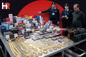 Seized gold jewellery, perfumes, and branded luxury handbags displayed by Pakistan Customs at Jinnah International Airport.