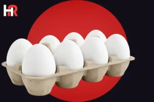 A cardboard egg carton holding eight white eggs, positioned in front of a large red circle on a black background. A stylized white and red 'HR' logo is located in the top left corner.