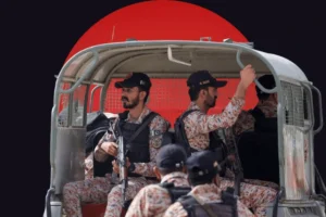 karachi rangers soldiers sitting in a moving vehicle along with a motorcycle on which two soldiers are escorting the vehicle