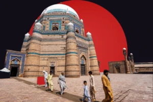 A stylized composite image featuring a large historical Islamic tomb, likely the Tomb of Shah Rukn-e-Alam, characterized by its octagonal brick structure, intricate blue tile work, and large white dome. In the foreground, several men and a child dressed in traditional shalwar kameez are walking across a wide brick courtyard. The scene is set against a dark, contrasting background dominated by a massive, solid red circle positioned directly behind the architecture
