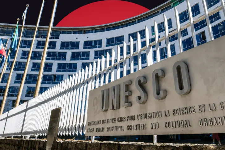 The curved, multi-story facade of the UNESCO headquarters building with a large stone sign in the foreground displaying the 'UNESCO' name. The structure is set against a stylized dark background dominated by a massive, solid red circle rising behind it.