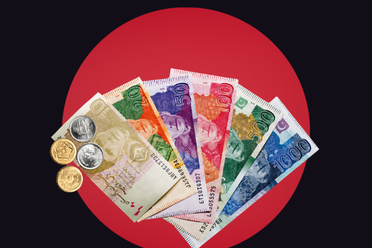 A fan-shaped arrangement of Pakistani Rupee banknotes and coins against a dark background with a large, solid red circle.