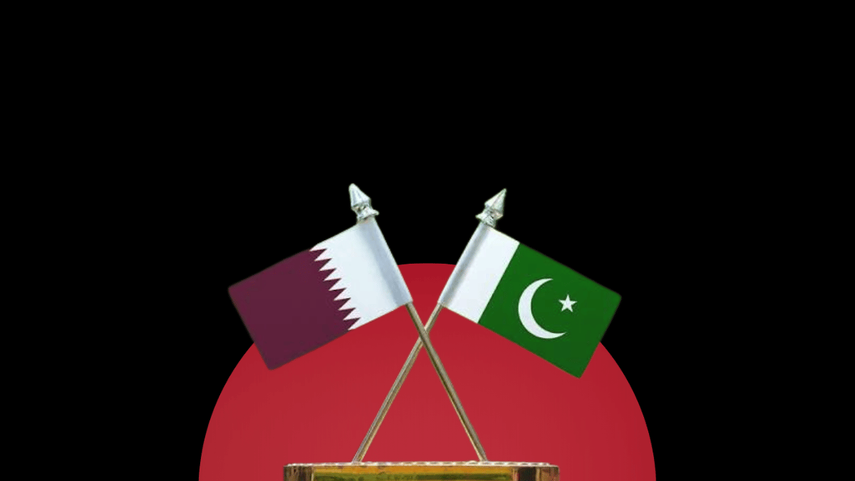 Crossed table flags of Qatar and Pakistan mounted on a gold stand, set against a dark background featuring a massive solid red circle.