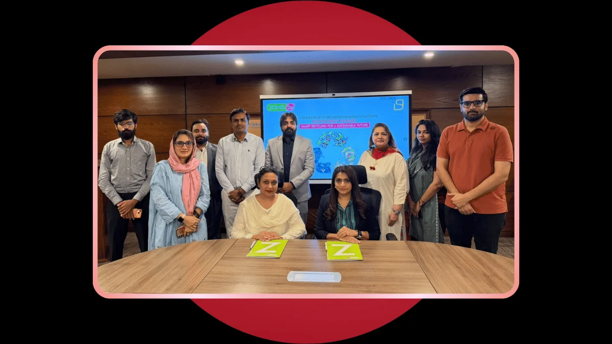 Corporate representatives and team members gathered around a conference table for an official signing event, set against a dark background with a red circle and the headline 'Zong Launches Smart Waste Stations with ISP.'